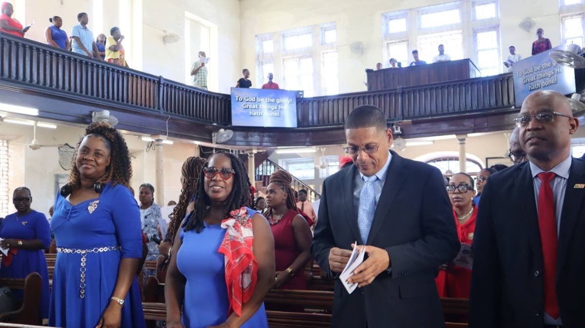 From left: Sophia Hamilton-Brown, deputy postmaster-general 1; Post and Telecommunications Department; Carol Saunders-Hammond, senior director, corporate services, Post and Telecommunications Department; Donovan Williams, Minister of State in the Ministry 
