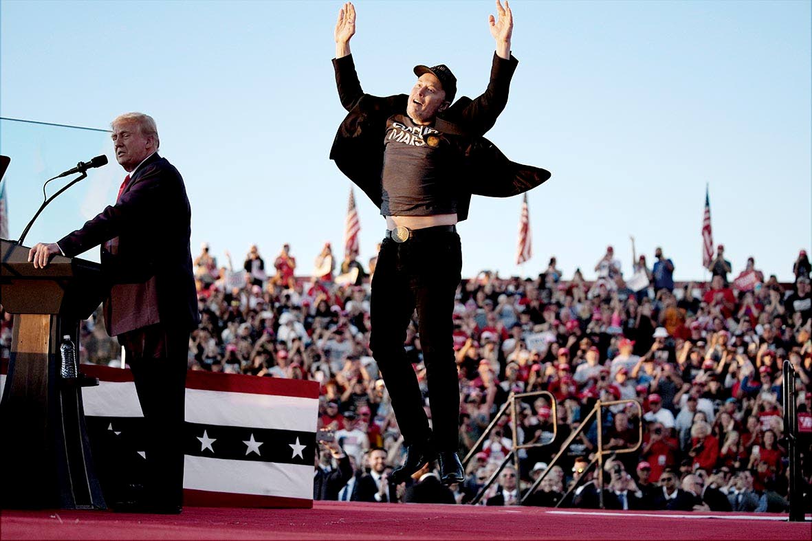 In this October 5, 2024 file photo, Elon Musk jumps on the stage as Republican presidential nominee, former President Donald Trump speaks at a campaign rally at the Butler Farm Show in Butler, Pennsylvania.