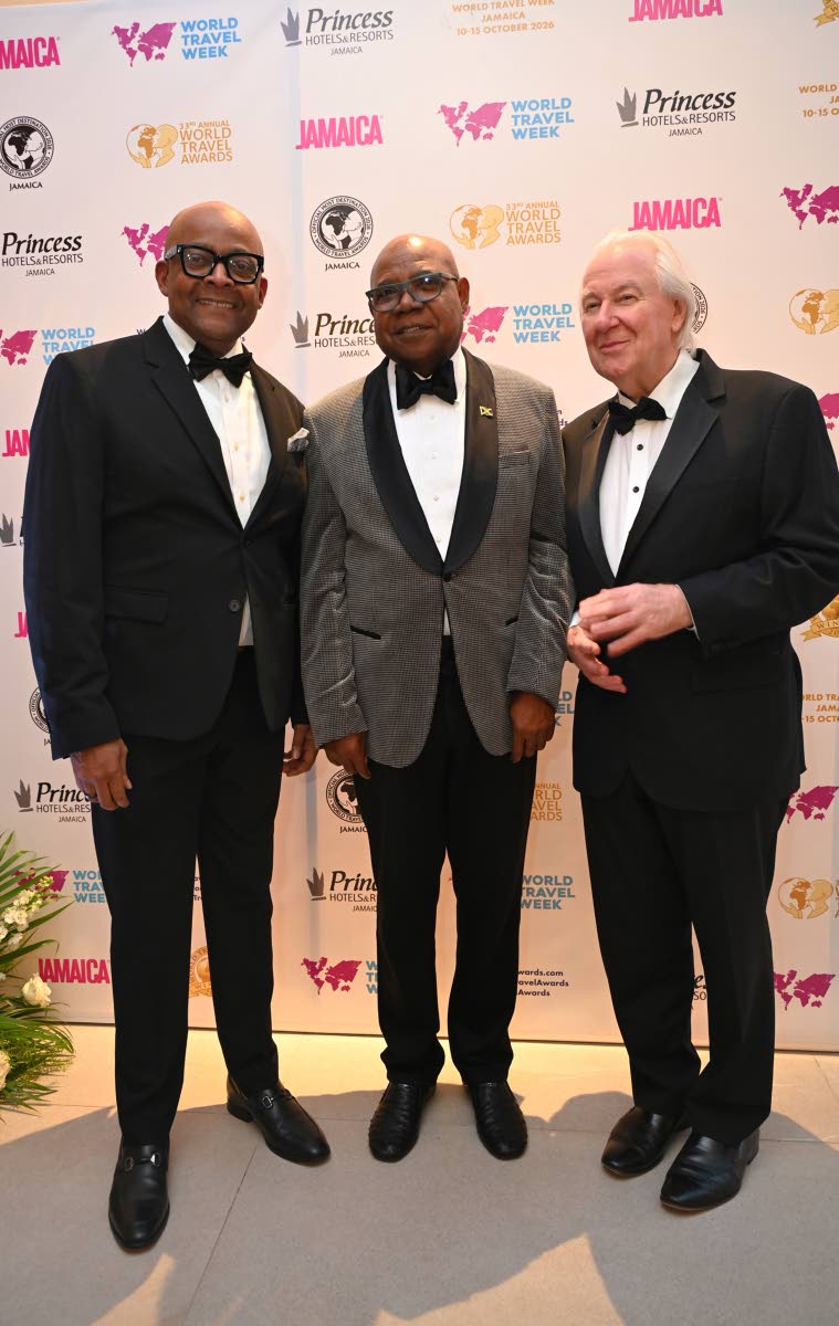 From Left: Director of Tourism Donovan White, Minister of Tourism Edmund Bartlett, and Graham Cooke, founder and president of the World Travel Awards (WTA), pause their confab for some lens time.