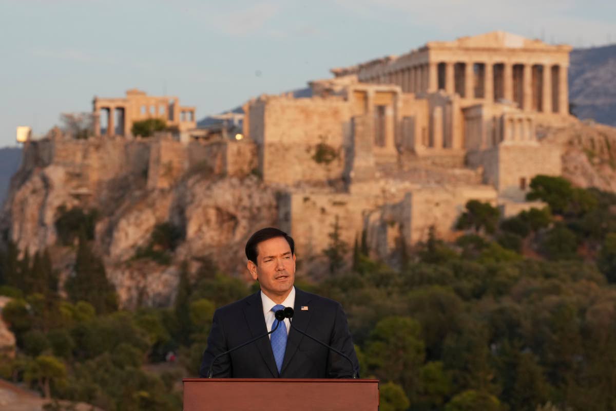 US Secretary of State Marco Rubio speaks at the Pnyx hill, where ancient Athenians held democratic assemblies, with the ancient Parthenon temple atop the Acropolis in the background, in Athens, Wednesday, October 7, 2026. (AP Photo/Mark Schiefelbein, Pool)
