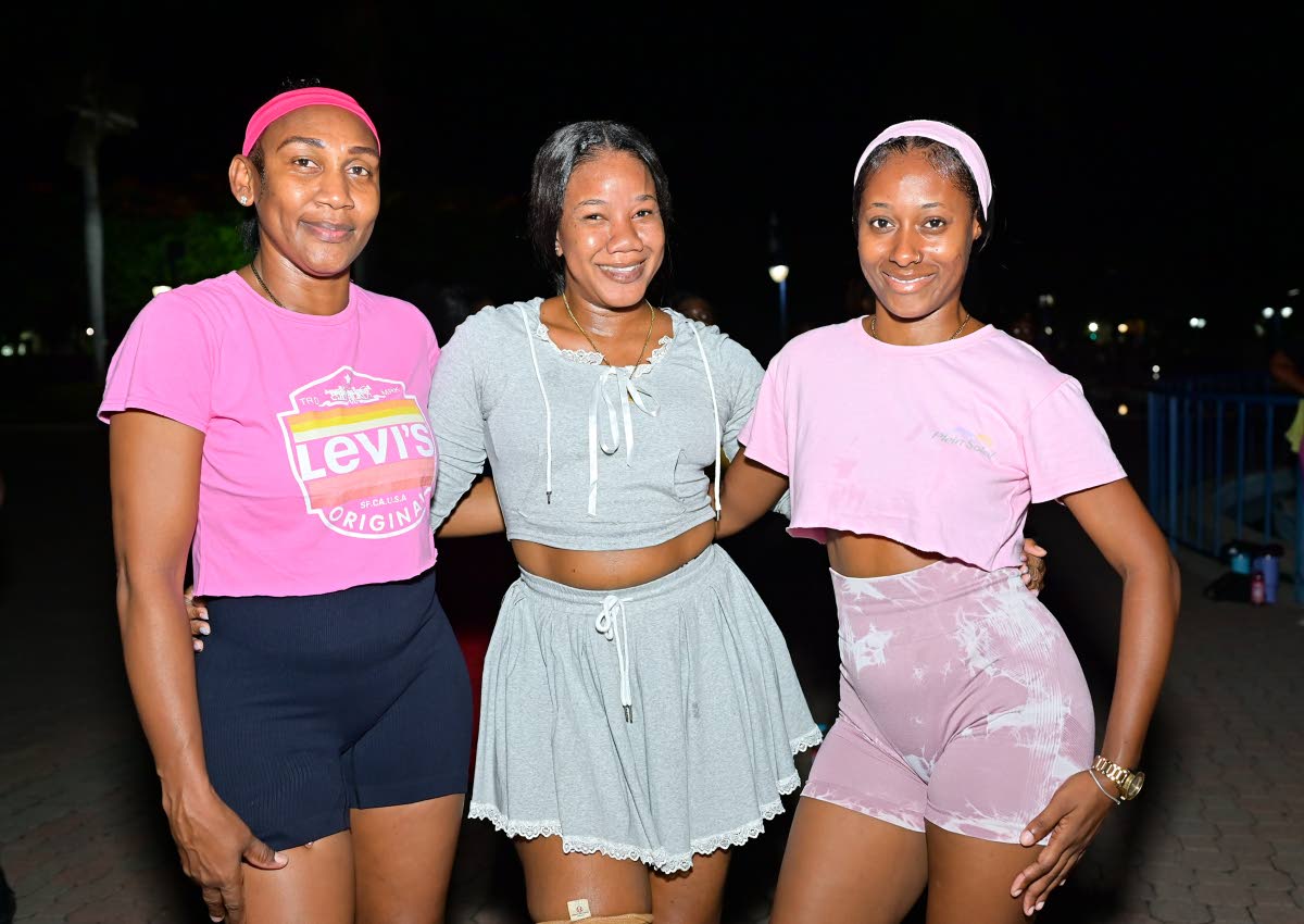 Gal pals (from left) Dowan Thompson, representing AC Hotel Kingston, and Grapevine Marketing brand marketers Crystal Edwards and Shanese Smith get all cute for a worthy cause.