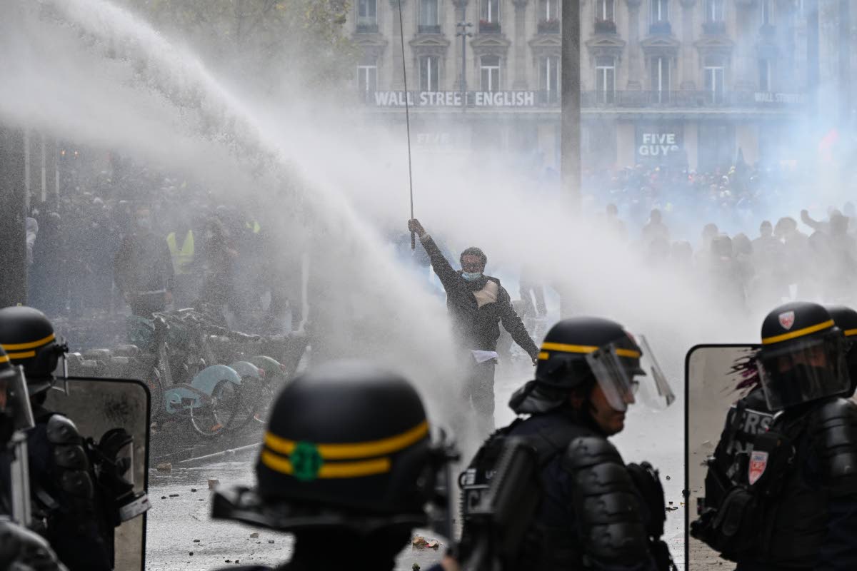 Protesters face police during a demonstration against rising living costs, joining students' grievances, in Paris, Saturday, Oct. 17, 2026. (AP Photo/Emma Da Silva)