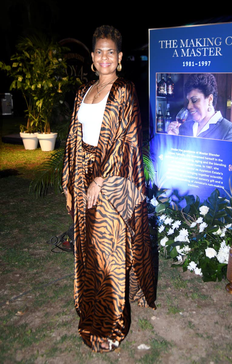 Kerry-Ann Anderson-Jones, managing director of TM Traders Limited, taps Rhea Imani for her look of the night.