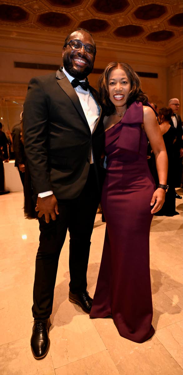 Chris Benjamin, community relations officer at the Consulate General of Jamaica in New York, and Naomi Francis, assistant director of international affairs at Hartsfield-Jackson Atlanta International Airport, pose for our lens. Benjamin opts for a traditio