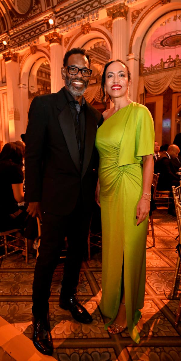 TR Sports’ Tim Ralph and Caron Chung, executive director of American Friends of Jamaica, strike a pose for our lens. Ralph sports a black tuxedo while Chung stands out in a draped, lime-green one-shoulder gown.