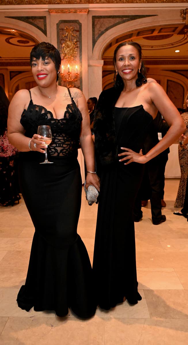 Judine Campbell-Stevenson (left) and Monique Daley coordinate in elegant black Mac Duggal gowns.