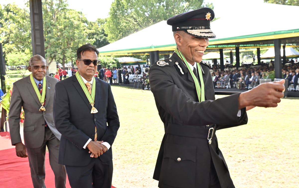 From left: Recipients of the Order of Distinction in the Rank of Commander, Professor Dr Evan Dale Abel, Wilfred Baghaloo and Stewart Beckford, commissioner of the Jamaica Fire Brigade, march off during the National Honours and Awards Ceremony 2026 at King