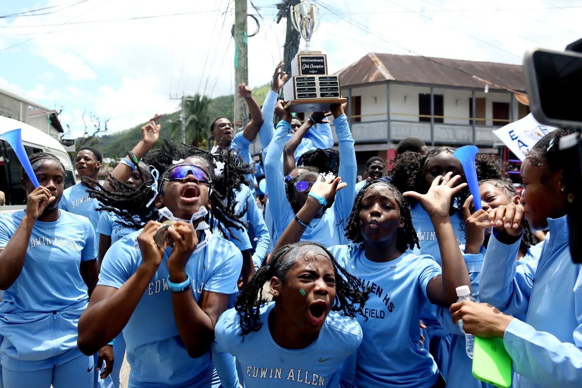 Edwin Allen High School celebrate winning the ISSA Girls’ Championships title in Frankfield Square, Clarendon. 