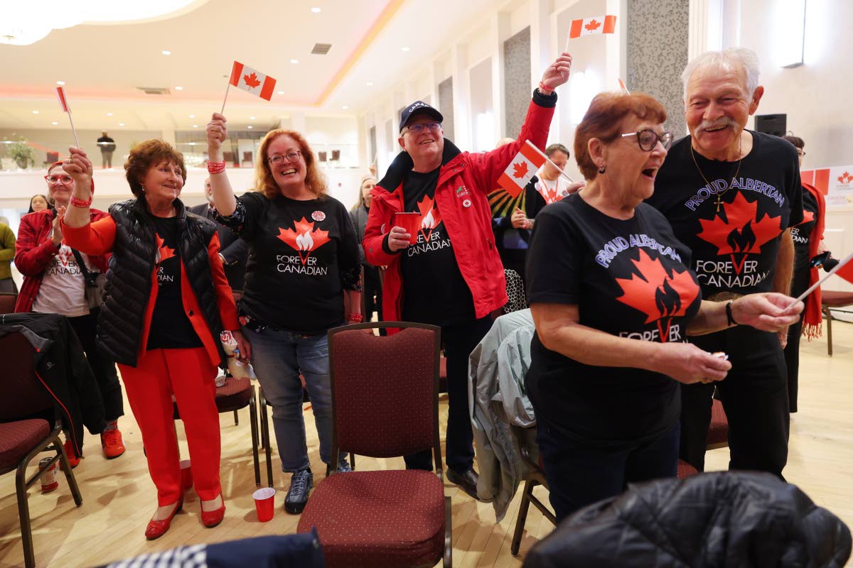 Supporters wait for results at the pro-Canada watch party in Edmonton, Alberta Monday, Oct. 19, 2026. (James Maclennan/The Canadian Press via AP)