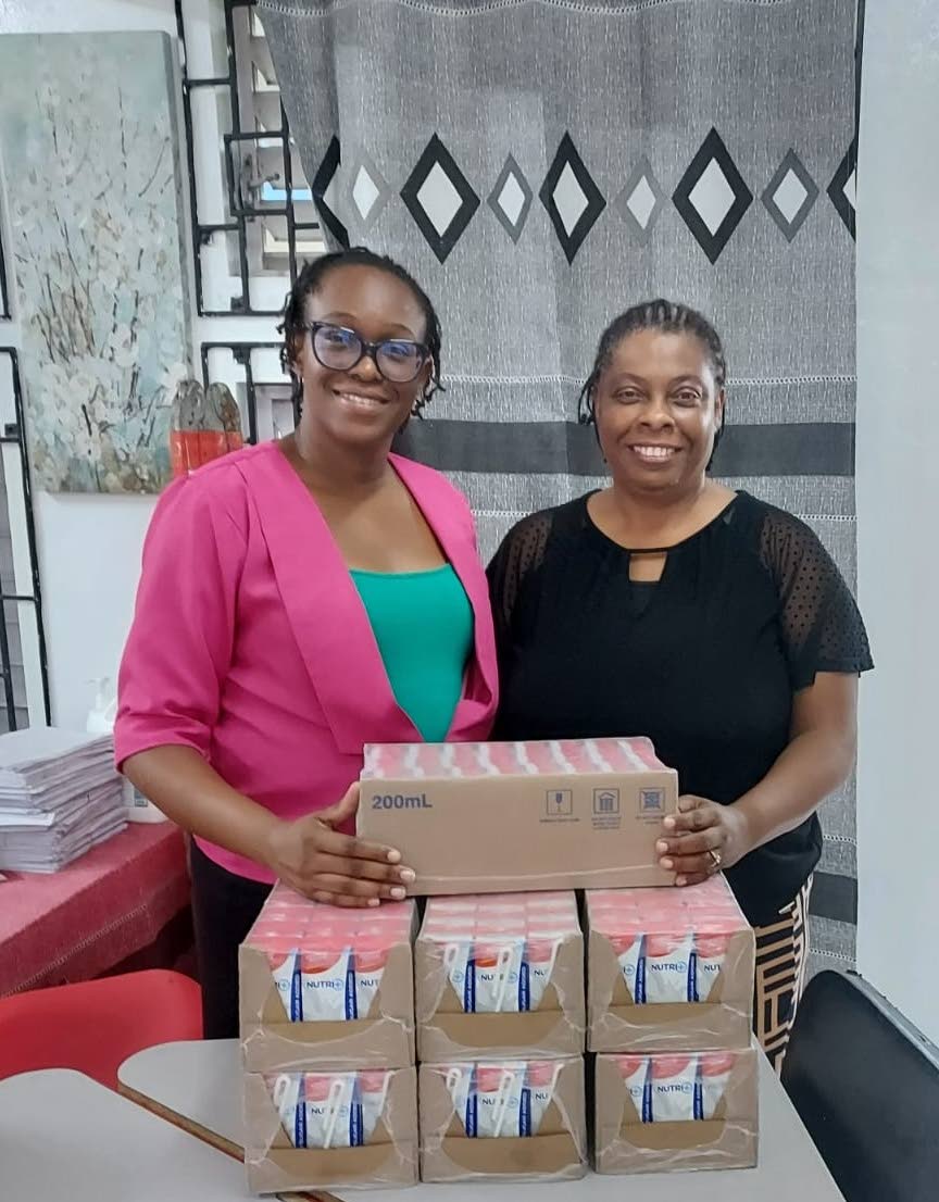 From left: Shanique Dinham and Andromeda Drummond Willocks, guidance counsellors at the Anchovy Primary School in St James, display boxes of Nutri+ Milk. Seprod has committed to donating 9,600 units of milk to the school throughout the 2026/2027 academic y