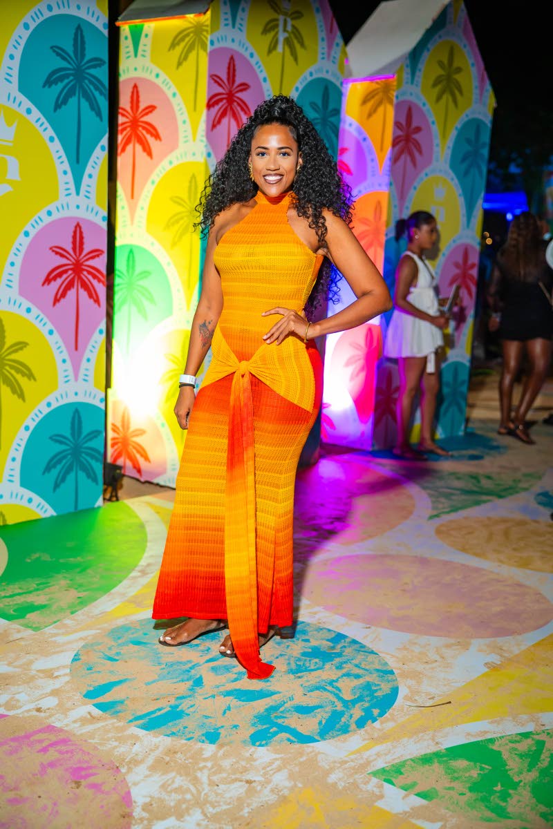 Bonnie Lee, operations manager at Boss Destinations, poses for the camera in a sunset halter dress.