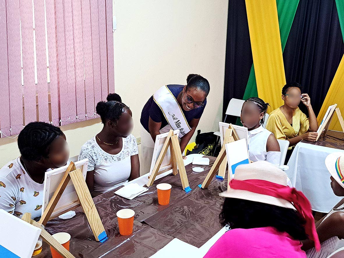 Miss St James Festival Queen 2026 Tanya Kentish (centre) interacts with female wards of the state and other attendees during the  launch of the Her Voice mentorship programme in Montego Bay, St James, last Friday.