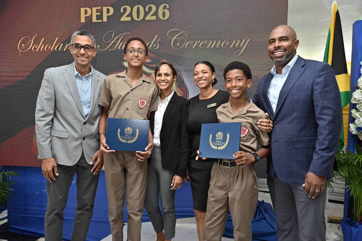 From left: Timothy and Lori Thwaites with their son, Noah, and Steven and Mary Whittingham with their son, James, following presentations at the Annual Primary Exit Profile (PEP) Scholarship Awards Ceremony at Shortwood Teachers’ College in St Andrew on 