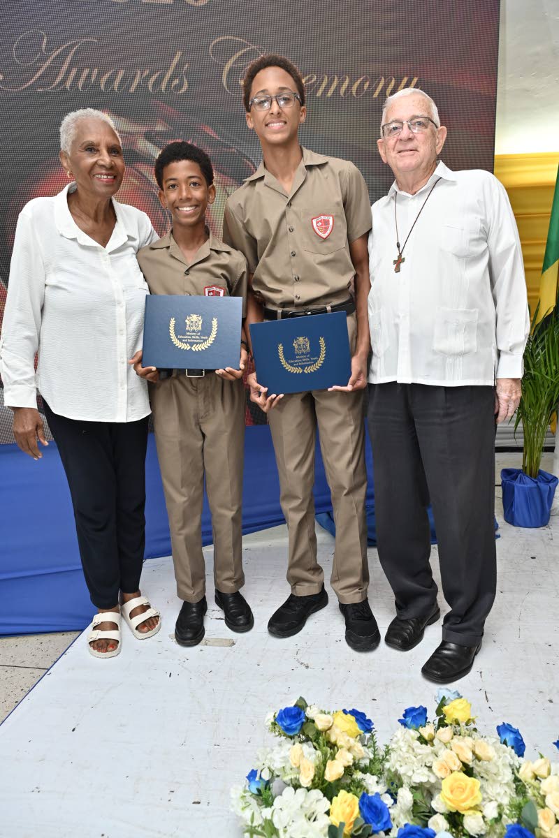 From left: Marcia Thwaites, wife of Deacon Ronald Thwaites; scholarship recipients James Whittingham and Noah Thwaites; and their grandfather, Deacon Ronnie Thwaites.