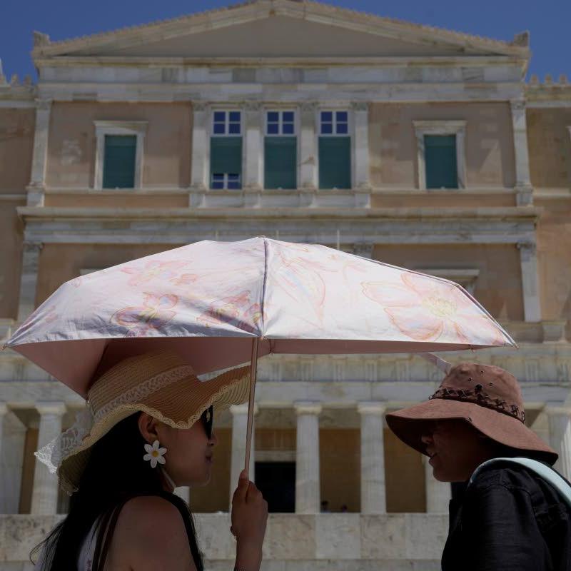 The sun hat is everywhere in Athens as crowds grow larger at ancient sites