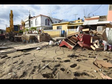 This photo shows household items piled in a mud-strewn section of Catherine Hall, Montego Bay, St James. 
