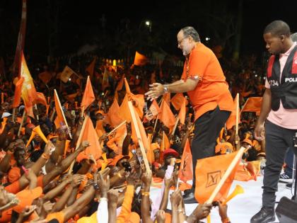 Mark Golding, president of the PNP, greeting supporters at the Cental Jamaica mass meeting held on August 24 ahead of the general election.
