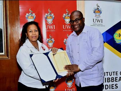 Michelle Williams, VP Records’ regional director of Caribbean and Latin America, and Professor Densil Williams, principal of the UWI, Mona campus, at the launch of the VP Foundation ECEM Scholarship.