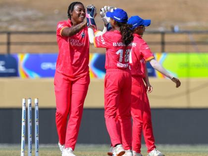 Barbados Royals Chinelle Henry (left) celebrates with teammates during their match against the Trinbago Knight Riders at the Providence Stadium in Guyana yesterday.