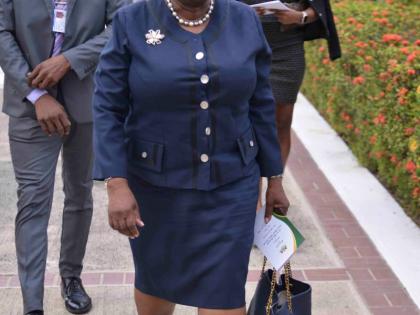 Outgoing Director of Public Prosecutiona Paula Llewellyn arriving at yesterday’s swearing-in ceremony Prime Minister Dr Andrew Holness on the lawns of King’s House. 