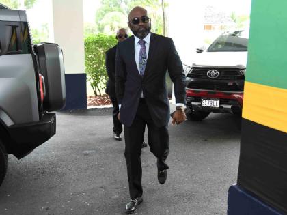 Dr Andrew Wheatley, arriving at King’s House yesterday, shortly before being sworn in as minister without portfolio in the Office of the Prime Minister, with responsibility for science, technology and special projects. 