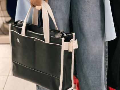 Melissa Moses Designs’ tote collection blends classic black-and-white hues with timeless elegance.