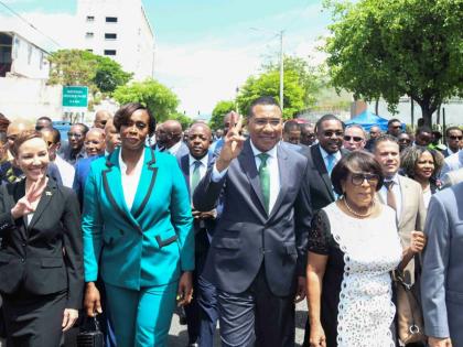 Members of parliament of the Jamaica Labour Party, led by Dr Andrew Holness arrive for the swearing-in ceremony at Gordon House. 