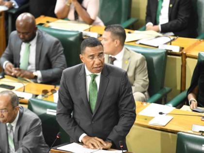 Prime Minister Dr Andrew Holness, and members of parliament of the ruling party at the swearing-in ceremony at Gordon House. 