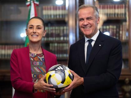 Prime Minister of Canada Mark Carney presents President of Mexico Claudia Sheinbaum with an official World Cup soccer ball ahead of their meeting at the Palacio National in Mexico City, Thursday, September 18, 2025.