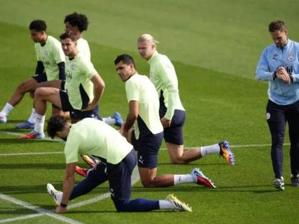 Manchester City’s Rodri and Erling Haaland (both centre, facing)  with team-mates during a training session at the City Football Academy, Manchester, England, on Wednesday, September 17, ahead of their Champions League soccer match against Napoli. 
