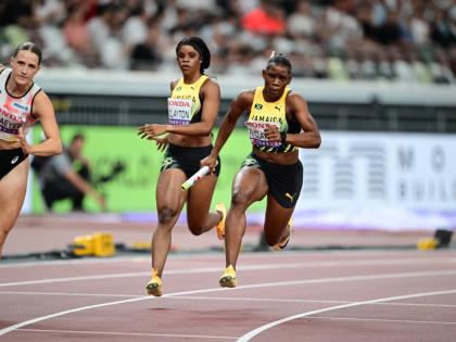 Jamaica’s Tia Clayton (centre) hands the baton over to Tina Clayton during a 4x100-metre heat at the World Athletics Championships inside the Japan National Stadium in Tokyo.