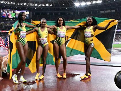 Jamaica's 4x400-metre women, from left: Dejanea Oakley, Nickisha Pryce, Stacey-Ann Williams, and Andrenette Knight celebrate the silver medal they won at the World Athletics Championships. The Jamaicans clocked 3:19.25.