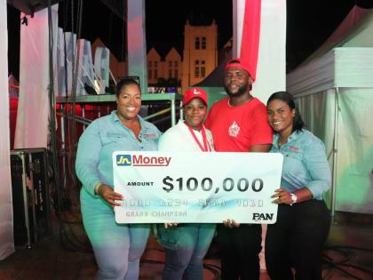Sanya Wallace-Innerarity (left), assistant general manager – strategy, marketing & sales, JN Money, and Cedrica Reid (right), marketing and sales manager, JN Money, celebrate with April Taylor (second left) and Craig Townsend, her business partner, for w