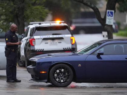 Police block off the street close to a US Immigration and Customs Enforcement office after a reported shooting, in Dallas on Wednesday, September 24, 2025. (AP Photo/Julio Cortez)