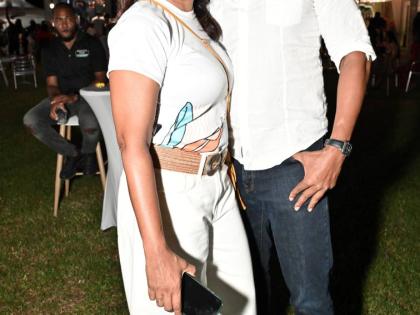 Richard Pandohie, CEO and managing director of Seprod, draws close to his wife Nicole, director of the Jamaica Food and Drink Kitchen, for a quick photo.