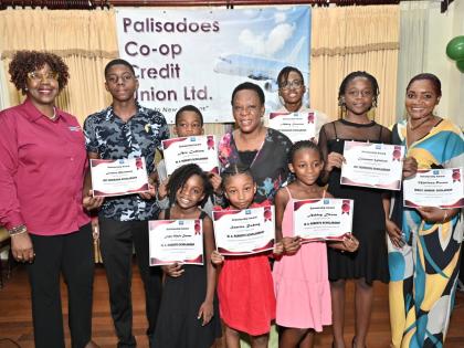 Dr Maxine Wilson (left), general manager, Palisadoes Co-operative Credit Union; and Celay Harwood-Gayle (centre), president, board of directors, pose with scholarships awardees at the Palisadoes Co-operative Credit Union Limited’s annual Scholarship Awar