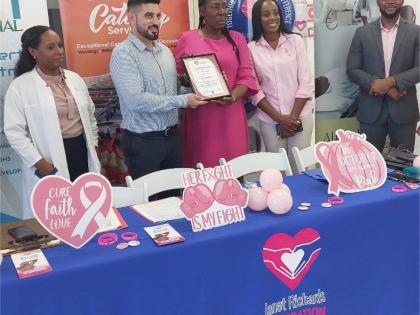 Janet Richards (centre), founder of the Janet Richards Foundation charity organisation, presents a certificate of appreciation to Samuel Afonso Diaz (second left), country manager for the Hospiten medical facility in Montego Bay, St James, during the launc