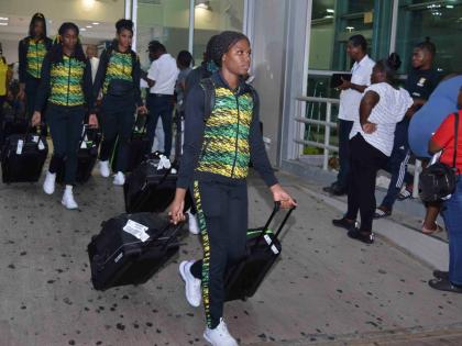 Jamaica’s under-21 Sunshine Girls arrive in island through the Norman Manley International Airport yesterday after their exploits at the World Netball Youth Cup in Gibraltar.