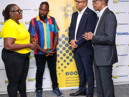 Community leader Patricia Durrant-Young (left), shares her experience with Project STAR’s impact in Parade Gardens, as resident Kevin Josephs (second left), Perrin Gayle (second right), CEO of NCB Foundation, and Ian Neita, chair of Project STAR’s Moni
