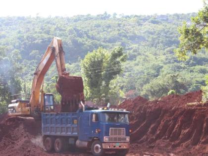 Bauxite being loaded onto a truck in the mines.