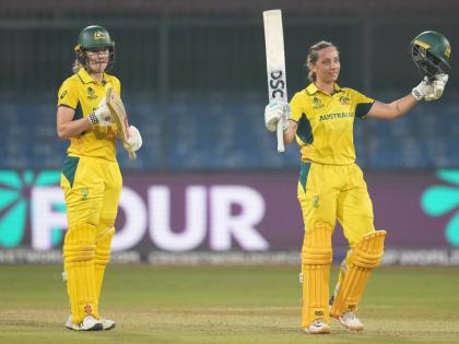 Australia’s Ashleigh Gardner (right) celebrates scoring a century as teammate Annabel Sutherland applauds during the ICC Women’s Cricket World Cup match against England at Holkar Cricket Stadium in Indore, India, yesterday.