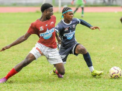 Eltham High School’s Antonio Fearon (left) finds himself going the wrong way against the dribble of Jamaica College’s Devonte Allen during their ISSA/WATA Manning Cup round-of-16 clash at the Jamaica College Ashenheim Stadium yesterday.