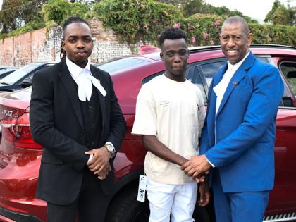 Dantay Brooks (centre) stands with Hugh Wildman (right) and Shemar Bryan, his attorneys, after his release from the Tower Street Adult Correctional Centre, Kingston, on March 7, 2025.
