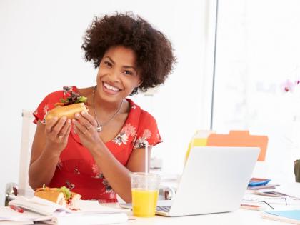 Representational image of a working woman taking a lunch.