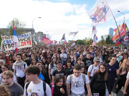 People gather, among them students, to walk on the street towards the northern city of Novi Sad, for a huge rally on November, marking the first anniversary of a train station disaster that killed 16 people, in Belgrade, Serbia.