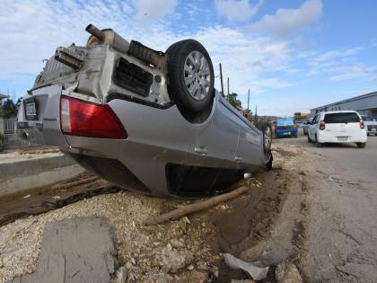 A car sits on its roof in Catherine Hall, a community in Montego Bay where homes, businesses and infrastructure suffered heavy damage due to Hurricane Melissa.