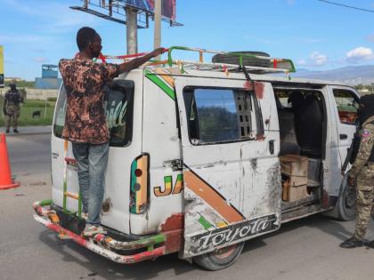 Police officers patrol an area near the Toussaint Louverture International Airport in Port-au-Prince, Haiti.