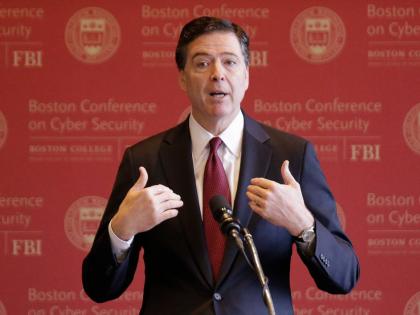 FBI Director James Comey gestures as he speaks on cyber security at the first Boston Conference of Cyber Security at Boston College, March 8, 2017, in Boston. (AP Photo/Stephan Savoia, File)