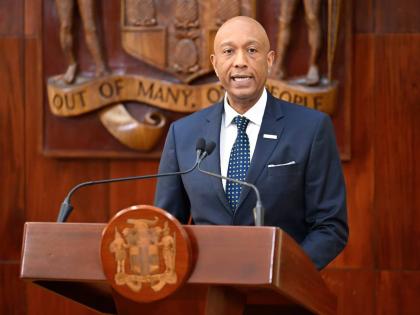 Managing Director, Development Bank of Jamaica (DBJ), Dr David Lowe, addressing a press briefing at Jamaica House on November 26