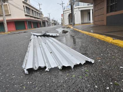 Zinc sheeting is seen in the street after being blown from its moorings by Hurricane Melissa, October 28, 2025.